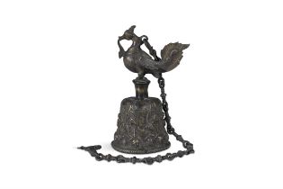 A BRONZE CINGALESE BELL, with mythological bird handle, the body cast with tendrils, flowerheads and