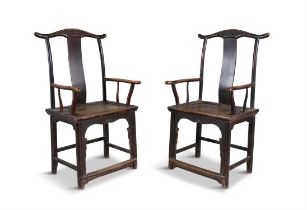 A PAIR OF CHINESE ELMWOOD YOKE BACK SIDE CHAIRS, LATE 19TH CENTURY, each with wavy top rim and solid