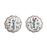 A PAIR OF KANGXI FAMILLE VERTE '100 ANTIQUES' PATTERN DISHES, C.1700 each lobed shaped, enamelled