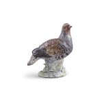 AN 18TH CENTURY MEISSEN FINELY PAINTED PORCELAIN MODEL OF A GREY PARTRIDGE standing in a leafy