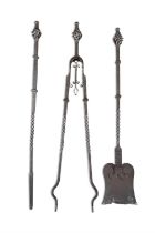 A SET OF THREE VICTORIAN POLISHED STEEL FIRE IRONS, with wrought spiral handles. c. 96cm long