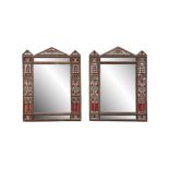 A PAIR OF MORROCAN CARVED WOOD AND VELVET BACKED RECTANGULAR WALL MIRRORS, with three-point pediment