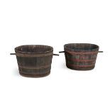A PAIR OF OVAL WINE VATS, each of coopered construction, one with painted metal straps. 48cm high,