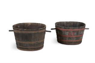 A PAIR OF OVAL WINE VATS, each of coopered construction, one with painted metal straps. 48cm high,