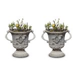 A PAIR OF 19TH CENTURY LEAD RENAISSANCE STYLE TWO-HANDLED URNS decorated with leaf sprays on