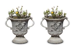 A PAIR OF 19TH CENTURY LEAD RENAISSANCE STYLE TWO-HANDLED URNS decorated with leaf sprays on