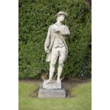 A LARGE COMPOSITE STONE FIGURE OF A STANDING RUSTIC with a tricorn hat after a model by Sir Henry