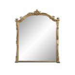 A LARGE GILTWOOD ARCHED OVERMANTLE MIRROR, 19TH CENTURY, the shaped plain glass plate below a
