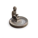 A VICTORIAN DOULTON STONEWARE GARDEN BIRDBATH in the form of a pixie seated at the edge of a