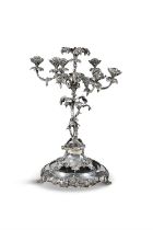 A 19TH CENTURY SEVEN BRANCH SILVER PLATED CANDELABRA IN THE FORM OF A FRUITING VINE, raised on