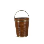 AN IRISH BRASS BOUND AND FRUITWOOD RIBBED BUCKET, C.1800 of coopered construction with swing