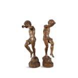 A PAIR OF FRENCH CARVED LIMEWOOD FIGURES OF BACCHIC YOUTH, 19TH CENTURY, wearing laurel wreathes,