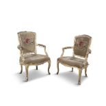 A PAIR OF FRENCH LOUIS XV GILTWOOD UPHOLSTERED FAUTEUILS, each with rectangular padded backs with