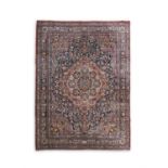 A FINE ANTIQUE BIDJAR CARPET, C.1900 with large central medallion on floral scroll field, with