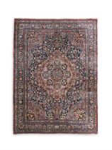A FINE ANTIQUE BIDJAR CARPET, C.1900 with large central medallion on floral scroll field, with