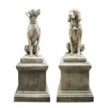 A PAIR OF COMPOSITE HOUNDS both seated, raised on stepped plinth bases. 156cm high including base,