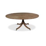 A REGENCY MAHOGANY OVAL BREAKFAST TABLE, C.1810 the tilt-top with moulded rim, raised on a turned