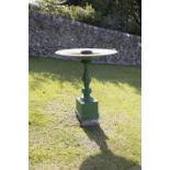A 19TH CENTURY CAST IRON PAINTED BIRD BATH with wide rim on lead column and square pedestal. 92cm