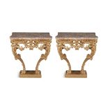 A PAIR OF GEORGE III STYLE GILTWOOD CONSOLE TABLES, 19TH CENTURY, each with a later shaped Spanish