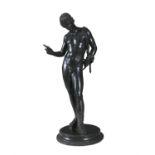 G. AMODIO (AFTER THE ANTIQUE) 19TH CENTURY A bronze figure of narcissus standing on a circular