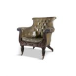 A GEORGE IV MAHOGANY FRAMED LIBRARY ARMCHAIR, with button back green leather back and seat