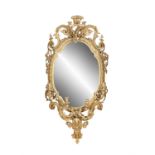 A 19TH CENTURY GILTWOOD GESSO OVAL GIRANDOLE MIRROR, the glass plate contained within a border of