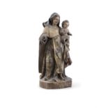 A 16TH/17TH CENTURY CARVED WOOD MODEL OF THE MADONNA AND CHILD, retaining much of its polychrome