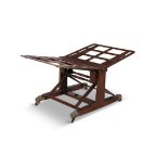 AN ADJUSTABLE MAHOGANY FOLIO STAND, 19TH CENTURY raised on trestle supports with foliate brass