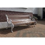 A VICTORIAN CAST IRON GARDEN BENCH, ATTRIBUTED TO COALBROOKDALE, with slatted timber back and
