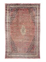 AN ANTIQUE HAMADAN RUG N.W. PERSIA, 545 X 342CM the central reserve with cream lozenge against a red