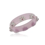 A DIAMOND AND RUBY BANGLE The diamond and rubies set in flowerhead motifs on a lilac bakelite