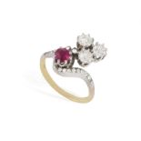 AN 18CT GOLD, RUBY AND DIAMOND RING Of cross-over design, set with a probably synthetic, oval,