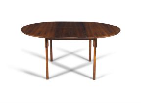 DINING TABLE A circular rosewood extending dining table with one leaf. Denmark, c.1960.