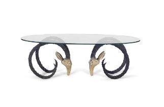 ALAIN CHERVET An oval glass topped coffee table in the style of Alain Chervet. France, c. 1970.
