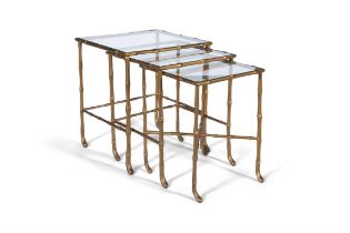 TABLES Giltmetal and clear glass nest of trio tables, simulating bamboo by Maison Bagues.