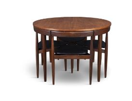 FREM ROJLE A teak circular extending dining table with 4 chairs by Hans Olsen for Frem Rojle.