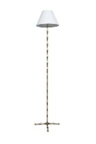 LAMP A Brass 'Bamboo' effect standard lamp, with cotton cream shade. Attrib. to Maison Bagues.