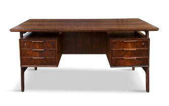 OMANN JUN A rosewood desk by Omann Jun. Denmark, c.1960, with maker's label. 153 x 80.5 x 73cm(h)