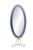 MIRROR An oval brass framed mirror, with blue glass surround on brass legs. Italy, c.1960.