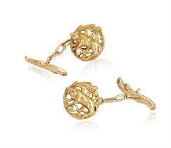 A PAIR OF EARLY 20TH CENTURY DIAMOND AND GOLD CUFFLINKS Of openwork design, depicting a lion