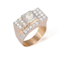 A DIAMOND TANK RING, CIRCA 1940 The geometric stepped design set with a central old
