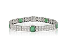 AN EARLY 20TH CENTURY EMERALD AND DIAMOND BRACELET Composed of five collet-set rectangular-cut