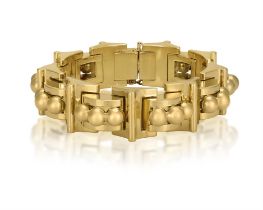 A RETRO GOLD BRACELET, CIRCA 1940 Of tank design, the articulated polished gold band composed of