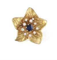 A SAPPHIRE AND DIAMOND PENDANT/BROOCH, BY CHAUMET Of flowerhead design, the circular-cut