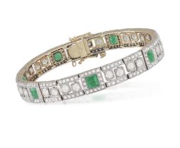 AN EARLY 20TH CENTURY EMERALD AND DIAMOND BRACELET Composed of articulated rectangular links,