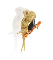 A GEM-SET NOVELTY BROOCH, CIRCA 1960 Modelled as a stylised bird perched on a corallium rubrum