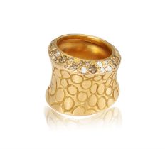A DIAMOND 'COCCO' DRESS RING, BY POMELLATO Designed as a textured concave band,