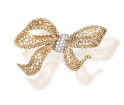 A DIAMOND AND SEED PEARL BROOCH, BY JEAN COMOY, CIRCA 1955 Of openwork bow design,