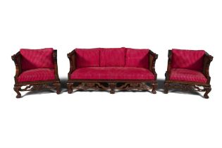 AN UPHOLSTERED THREE PIECE CANEWORK BERGERE SUITE comprising a three seat settee and two