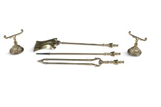 A SET OF THREE BRASS FIRE IRONS, together with a pair of small andirons